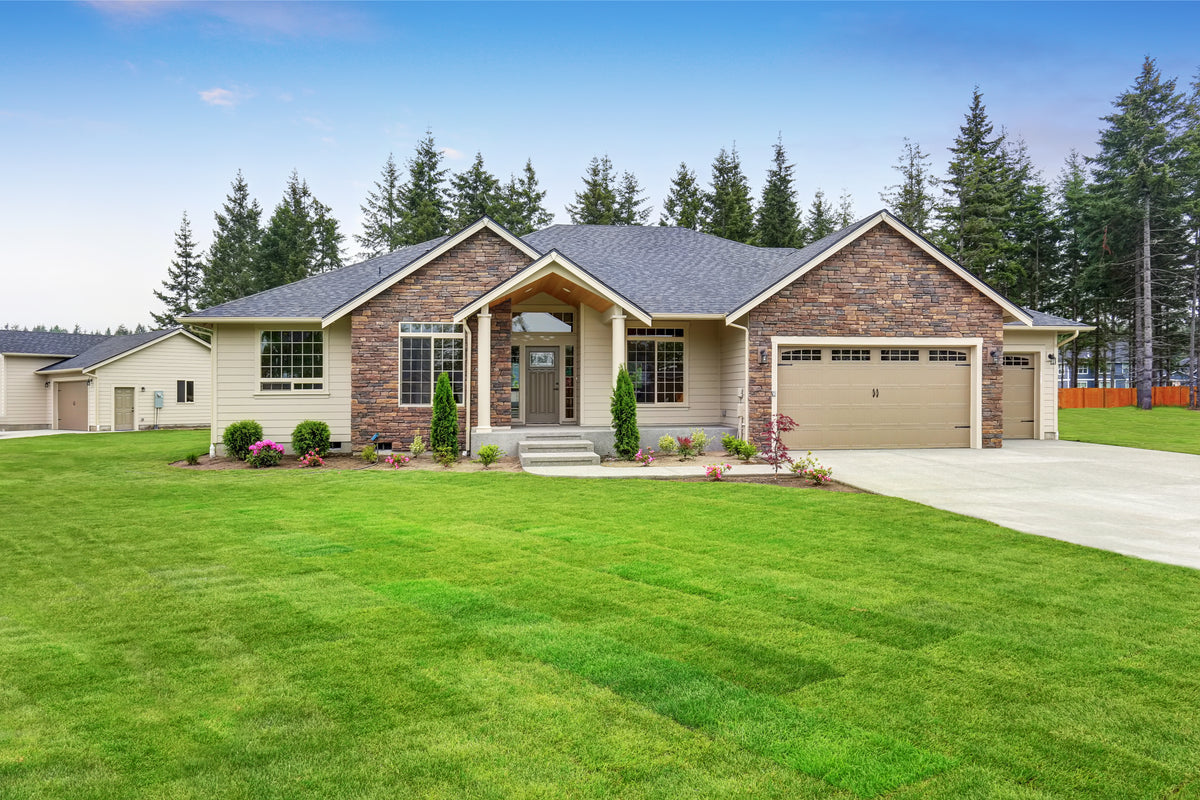 Single-story home with a large yard representing residential city and private well water testing by Kleer Blue Water.